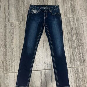 dark wash jeans with angel wing details on back